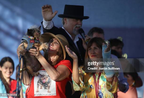 Dalrene Wright holds Scamp the Tramp as her owner Yvonne Morones claps during the World's Ugliest Dog contest at the Marin-Sonoma County Fair on June...