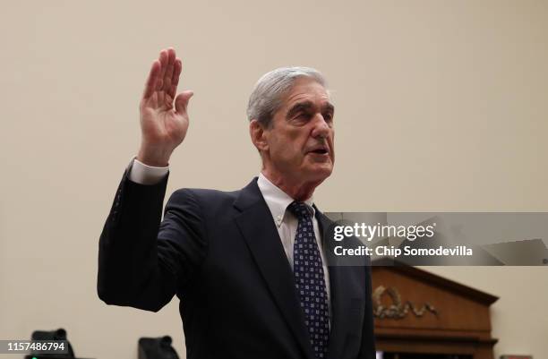 Former Special Counsel Robert Mueller is sworn in before testifying to the House Judiciary Committee about his report on Russian interference in the...