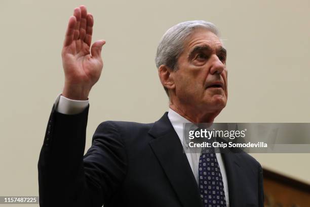 Former Special Counsel Robert Mueller is sworn in before testifying before the House Judiciary Committee about his report on Russian interference in...