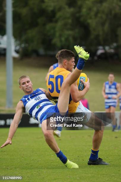 Matt Allen of the Eagles marks the ball against Morgan Davies of the Sharks during the round 11 WAFL match between the East Fremantle Sharks and West...