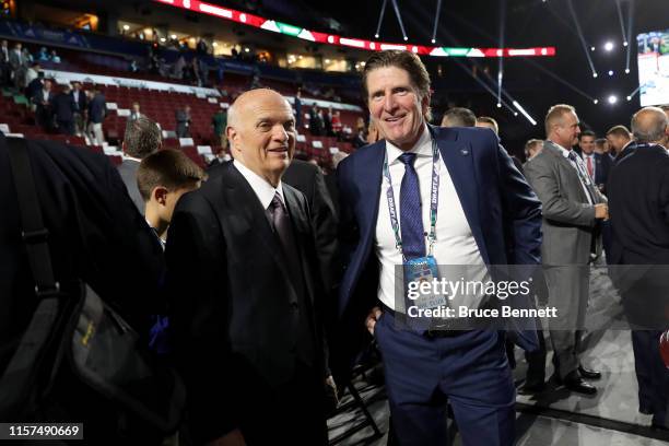 Lou Lamoriello of the New York Islanders and Mike Babcock of the Toronto Maple Leafs attend the first round of the 2019 NHL Draft at Rogers Arena on...