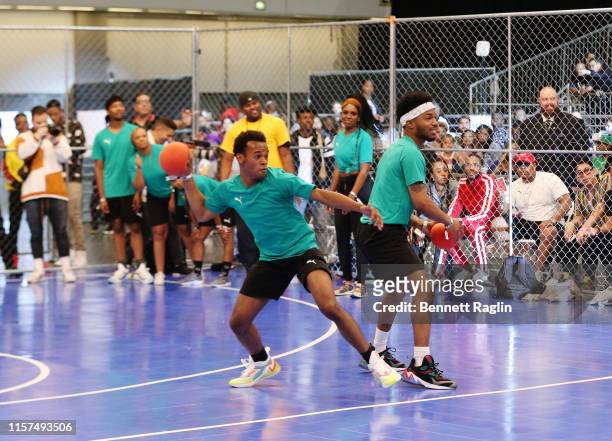 Jelani Winston and Christopher Jefferson play in the 2019 BET Experience Celebrity Dodgeball Game at Staples Center on June 21, 2019 in Los Angeles,...