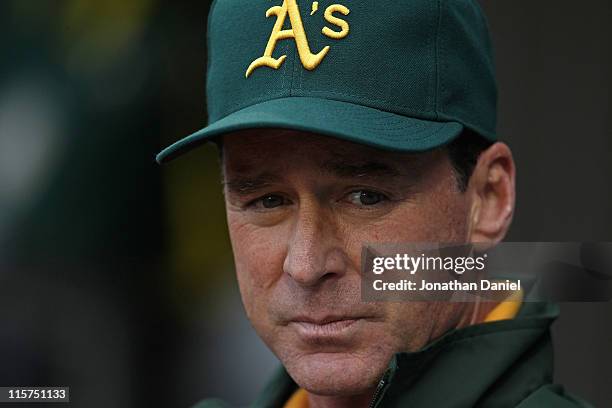 Bob Melvin, today named interim manager of the Oakland Athletics, waits in the dugout for a game against the Chicago White Sox at U.S. Cellular Field...