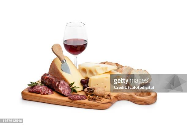 cheese and wine platter isolated on white background - cutting board stock pictures, royalty-free photos & images