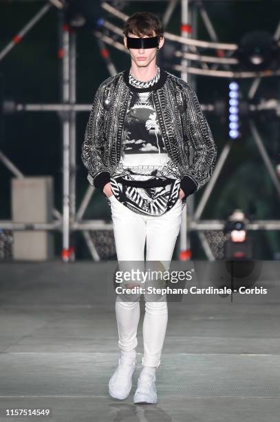 Model walks the runway during the Balmain Homme Menswear Spring Summer 2020 show as part of Paris Fashion Week on June 21, 2019 in Paris, France.