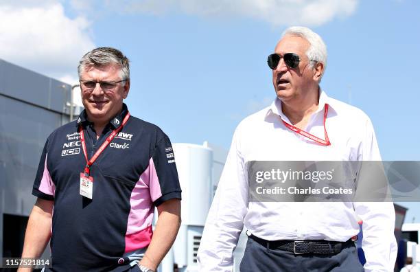 Owner of Racing Point Lawrence Stroll and Otmar Szafnauer, Team Principal and Chief Executive Officer of Racing Point walks in the Paddock before...