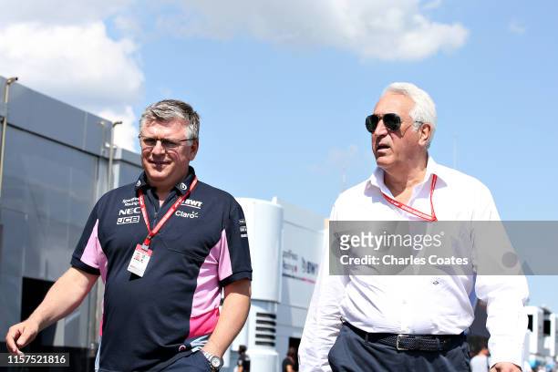 Owner of Racing Point Lawrence Stroll and Otmar Szafnauer, Team Principal and Chief Executive Officer of Racing Point walks in the Paddock before...