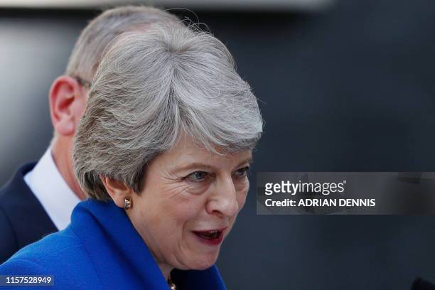 Britain's outgoing prime minister Theresa May gives a speech outside 10 Downing street in London on July 24, 2019 before formally tendering her...