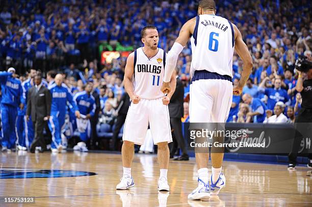 Jose Barea and Tyson Chandler of the Dallas Mavericks react to a play against the Miami Heat during Game Five of the 2011 NBA Finals on June 9, 2011...