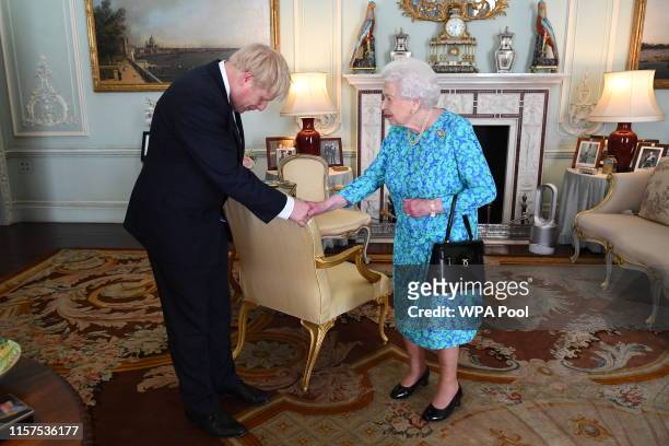 Queen Elizabeth II welcomes newly elected leader of the Conservative party, Boris Johnson during an audience where she invited him to become Prime...
