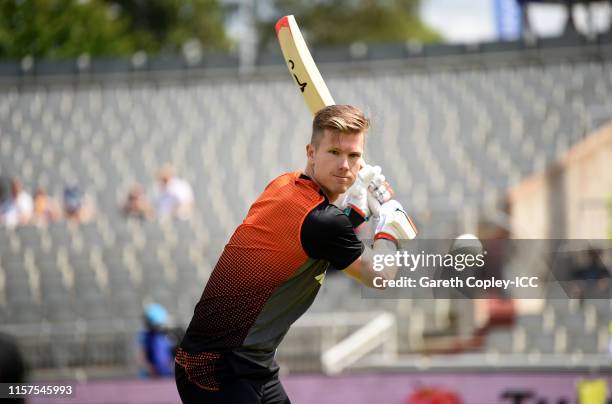 James Neesham of New Zealand warms up ahead of during the Group Stage match of the ICC Cricket World Cup 2019 between West Indies and New Zealand at...