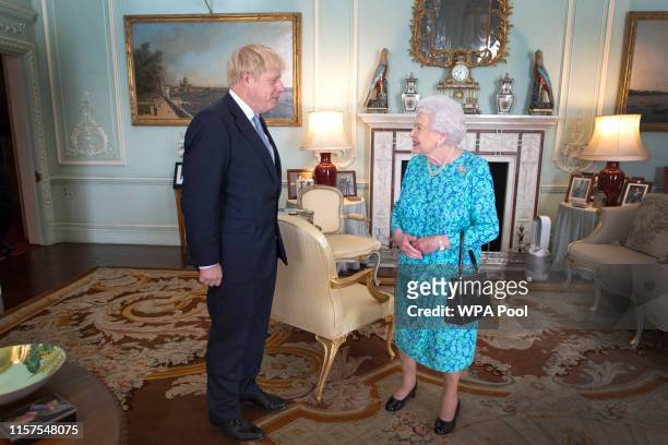 Queen Elizabeth II welcomes newly elected leader of the Conservative party, Boris Johnson during an audience where she invited him to become Prime...