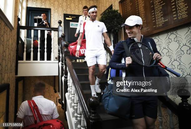 Andy Murray of Great Britain and playing partner Feliciano Lopez of Spain make their way to centre court prior to their Quarter-Final Doubles Match...