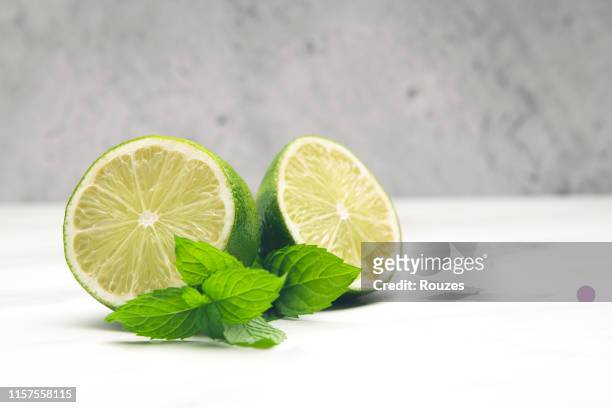 lemon with mint - lemon mint stock pictures, royalty-free photos & images