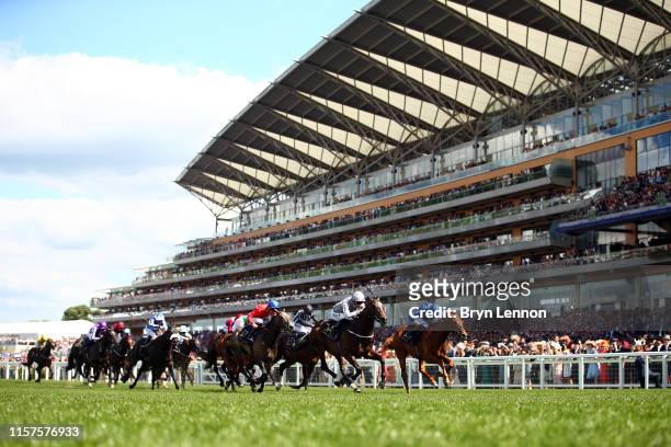 Daniel Tudhope riding Space Traveller in leads the field on his way to winning The Jersey Stakes on day five of Royal Ascot at Ascot Racecourse on...