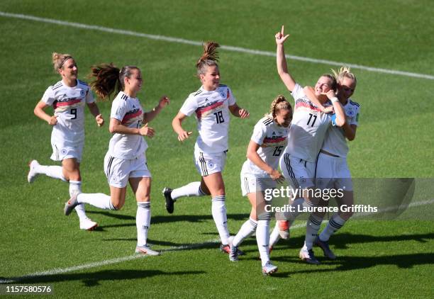 Alexandra Popp of Germany celebrates with teammates after scoring her team's first goal during the 2019 FIFA Women's World Cup France Round Of 16...