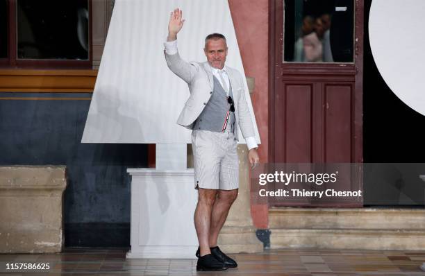 Designer Thom Browne acknowledges the audience at the end of the Thom Browne Menswear Spring Summer 2020 show as part of Paris Fashion Week on June...