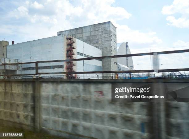 a close view of the new safe confinement (nsc) of the chernobyl nuclear power plant, ukraine - nsc stock pictures, royalty-free photos & images