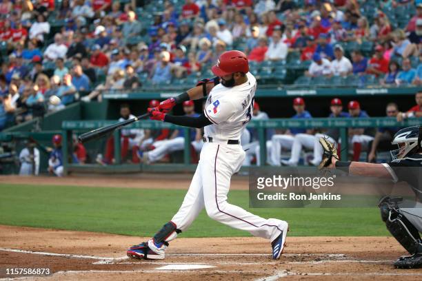 Nomar Mazara of the Texas Rangers hits a two run home run against the Chicago White Sox during the first inning at Globe Life Park in Arlington on...