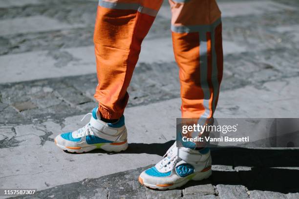 Siobhan Bell poses wearing an Astrid Andersen tracksuit and Chanel sneakers after the Sacai show at the Grand Palais during Paris Fashion Week -...