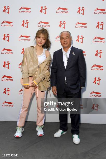 Li Yunwei and Li Ning attend the Li-Ning Menswear Spring Summer 2020 show as part of Paris Fashion Week on June 22, 2019 in Paris, France.