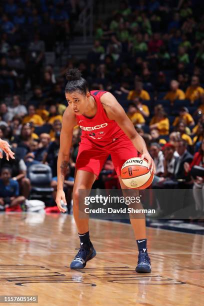 Natasha Cloud of the Washington Mystics handles the ball against the Minnesota Lynx on July 24, 2019 at the Target Center in Minneapolis, Minnesota...