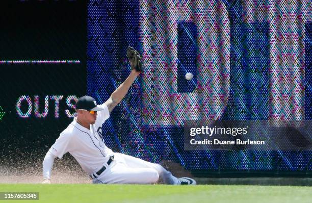 Center fielder JaCoby Jones of the Detroit Tigers can't get to a triple hit by Rhys Hoskins of the Philadelphia Phillies during the first inning at...