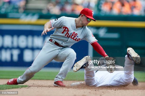 Shortstop Scott Kingery of the Philadelphia Phillies can't make the tag to get Brandon Dixon of the Detroit Tigers stealing second base during the...