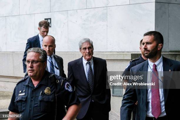 Former Special Counsel Robert Mueller departs after testifying to the House Intelligence Committee about his report on Russian interference in the...