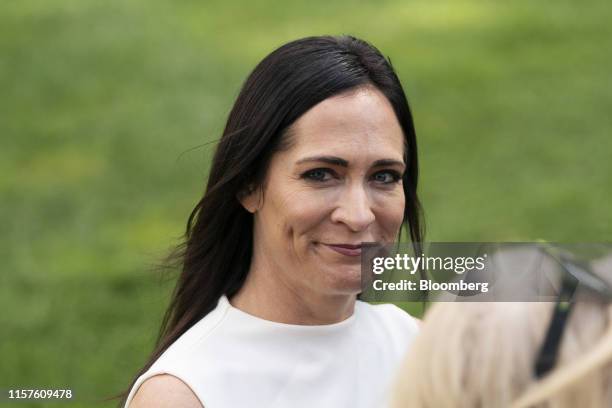 Stephanie Grisham, White House Press Secretary, smiles while U.S. President Donald Trump, not pictured, speaks to members of the media on the South...