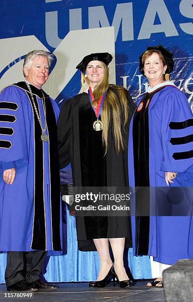 Bonnie Comley receives a distinguished alumni award from Chancellor Marty Meehan and Vice Chancellor Jacqueline F. Maloney of the University of...