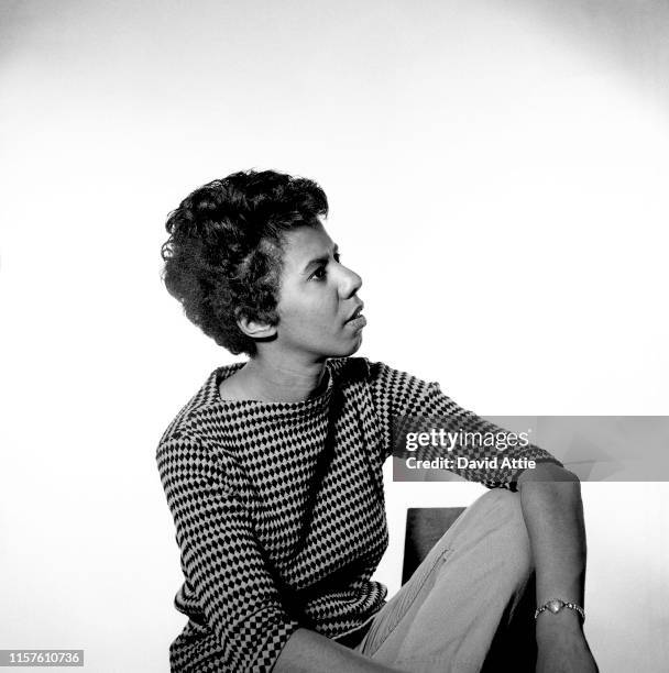 April 1959: Writer and playwright Lorraine Hansberry poses for a portrait in her apartment at 337 Bleecker Street in April, 1959 in New York City,...