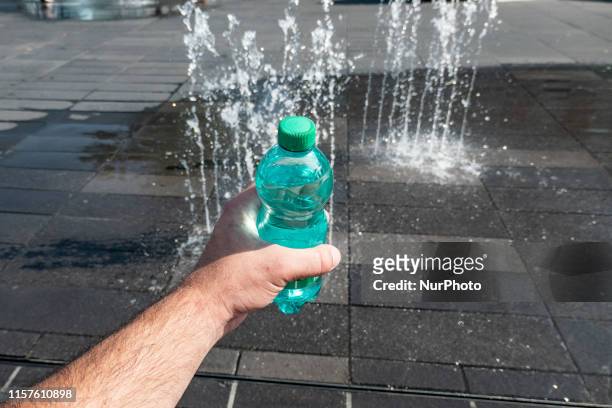 Heatwave in Europe on July 24, 2019. People in Eindhoven, North Brabant, The Netherlands looking for ways to cool down in the square, playing with...