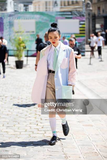 Sherry Shen is seen outside Thom Browne during Paris Fashion Week - Menswear Spring/Summer 2020 on June 22, 2019 in Paris, France.