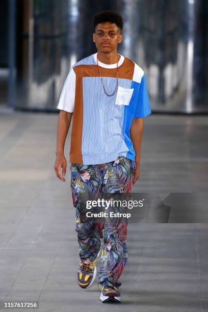 Model walks the runway at the White Mountaineering show during Paris Men's Fashion Week Spring/Summer 2020 on June 22, 2019 in Paris, France.