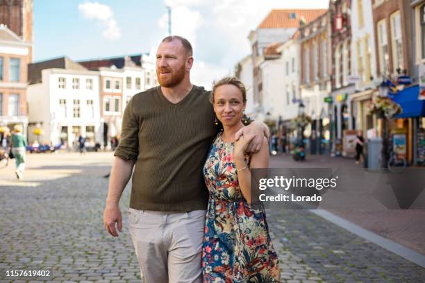 beautiful man and woman tourist couple in gouda - gouda stock pictures, royalty-free photos & images