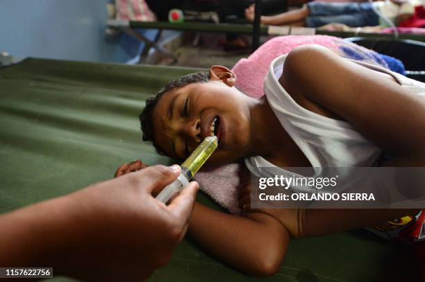 Boy infected with dengue, which vector is the Aedes aegypti, is assisted in the Roberto Suazo Cordova Hospital, in La Paz municipality, La Paz...