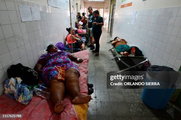 Patients infected with dengue, which vector is the Aedes aegypti, are assisted in a corridor of the Roberto Suazo Cordova Hospital, in La Paz...