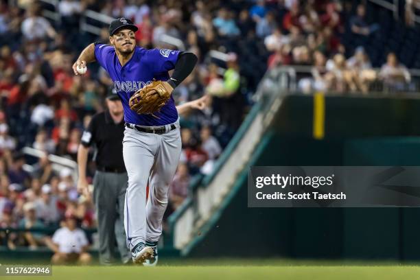 Nolan Arenado of the Colorado Rockies fields a ground ball against the Washington Nationals during the second inning of game two of a doubleheader at...