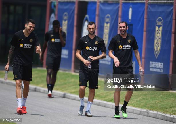 Matias Vecino, Marcelo Brozovic and Diego Roberto Godín Leal of FC Internazionale joke during a FC Internazionale training session on July 25, 2019...