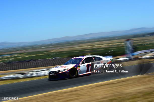 Denny Hamlin, driver of the FedEx Ground Toyota, drives during qualifying for the Monster Energy NASCAR Cup Series Toyota/Save Mart 350 at Sonoma...