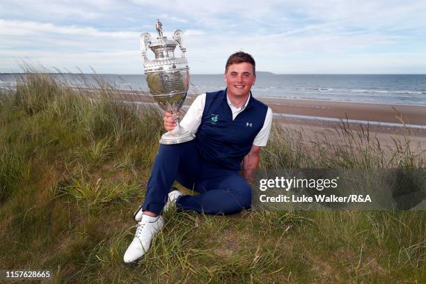 James Sugrue of Ireland winner of the R&A Amateur Championship poses with the trophy during day six of the R&A Amateur Championship at Portmarnock...