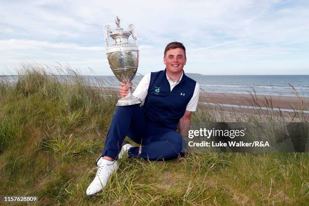 James Sugrue of Ireland winner of the R&A Amateur Championship poses with the trophy during day six of the R&A Amateur Championship at Portmarnock...