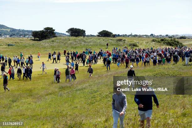 Crowds walk on the golf course during the finals during day six of the R&A Amateur Championship at Portmarnock Golf Club on June 22, 2019 in...