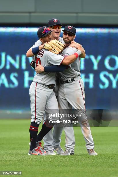 Eddie Rosario , Max Kepler and Jake Cave of the Minnesota Twins celebrate a 5-3 win over the Kansas City Royals at Kauffman Stadium on June 22, 2019...
