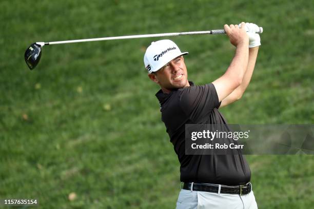 Chez Reavie of the United States plays his shot from the 15th tee during the third round of the Travelers Championship at TPC River Highlands on June...