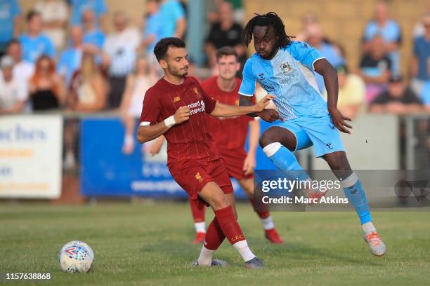 Pedro Chirivella of Liverpool in action with Fankaty Dabo of Coventry City during the Pre-Season Friendly match between Coventry City and Liverpool...
