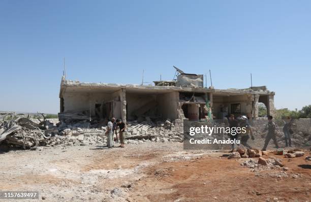 Civil defense members carry out search and rescue works at the site after airstrike hit the Kafar Roma district of Idlib, Syria on July 25, 2019.