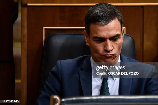 Spanish caretaker Prime Minister Pedro Sanchez attends the third day of a parliamentary investiture debate and vote to elect a premier, at the...