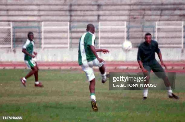 Nigerian captain Daniel Amokachi takes part in a team practice 22 January at their ground in Abeokuta, southwest Nigeria, the day before an African...